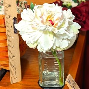 Beautiful faux flower in vintage container